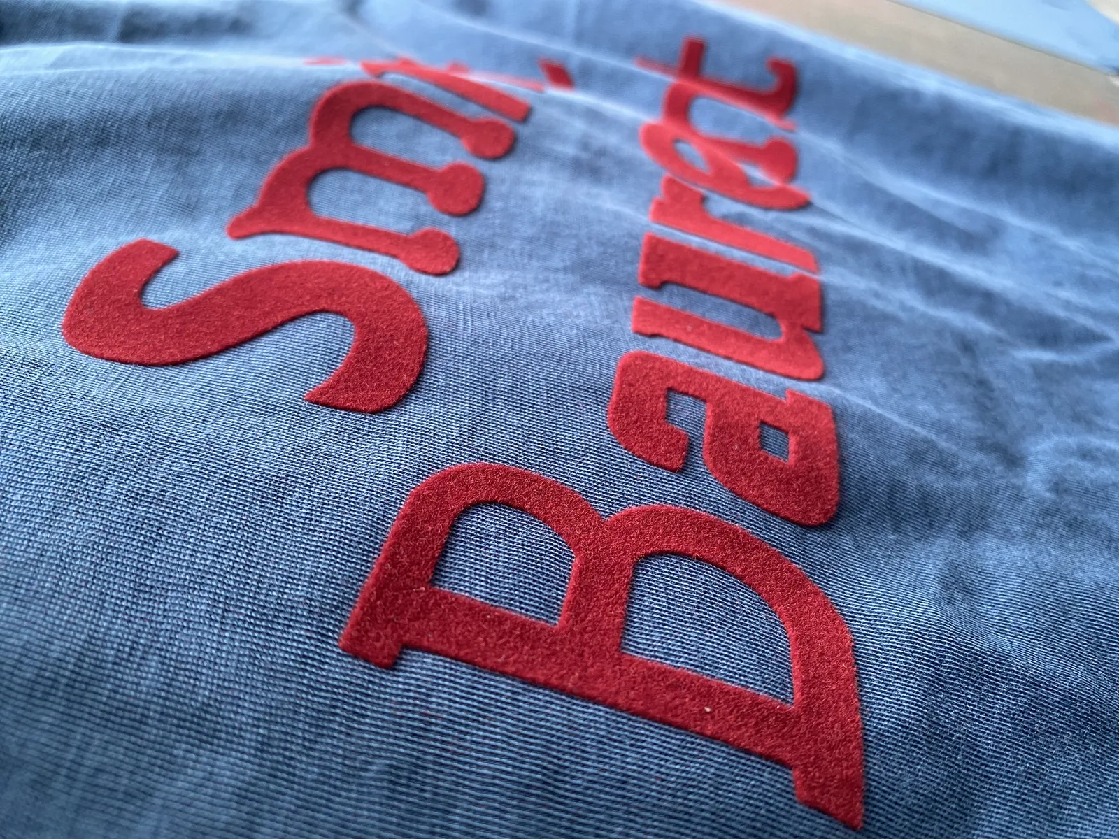 Raised flock printing detail for custom T-shirts and hoodies