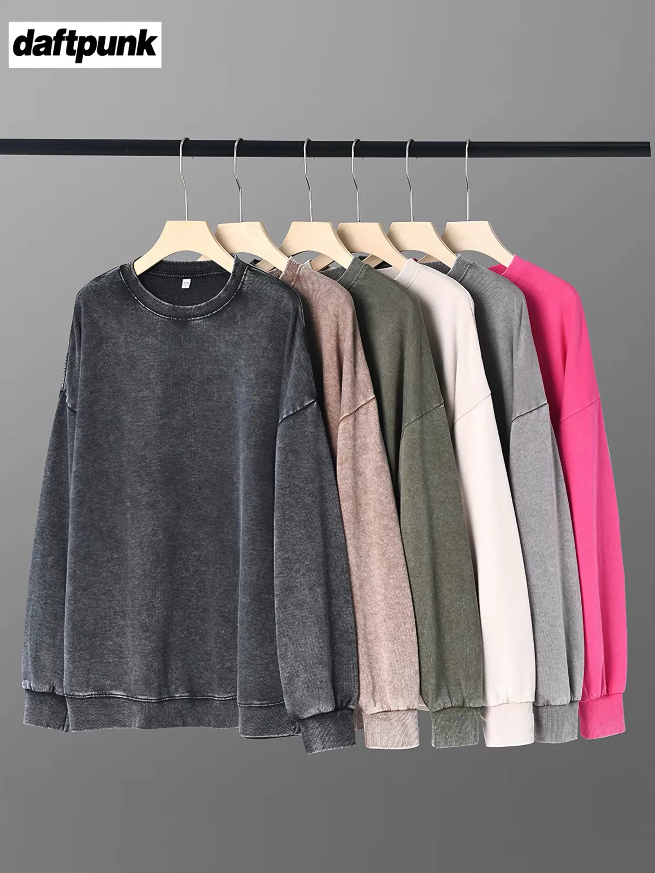 Multiple washed crew sweatshirts on hangers
