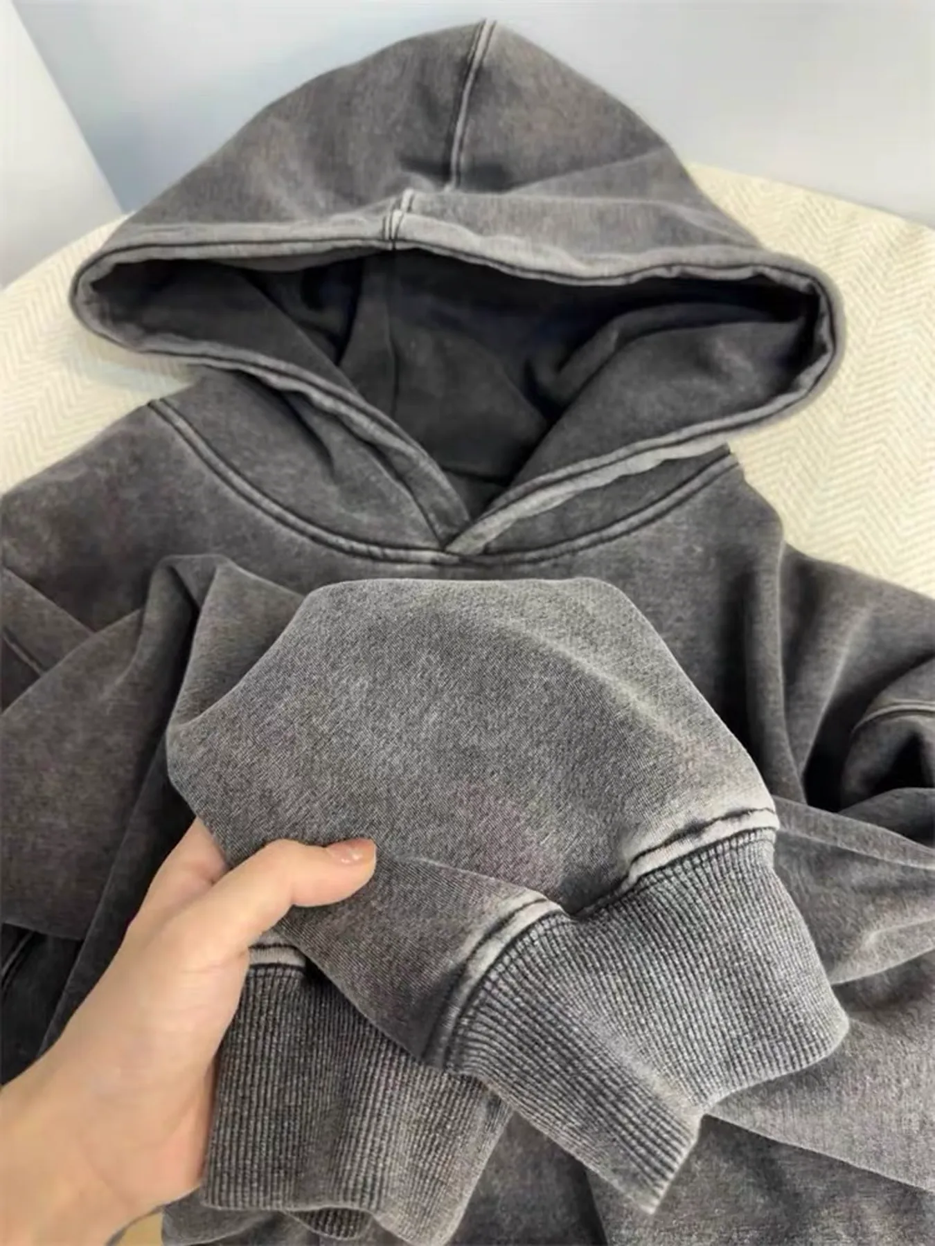 Washed fleece hoodie sleeve and rib cuff detail