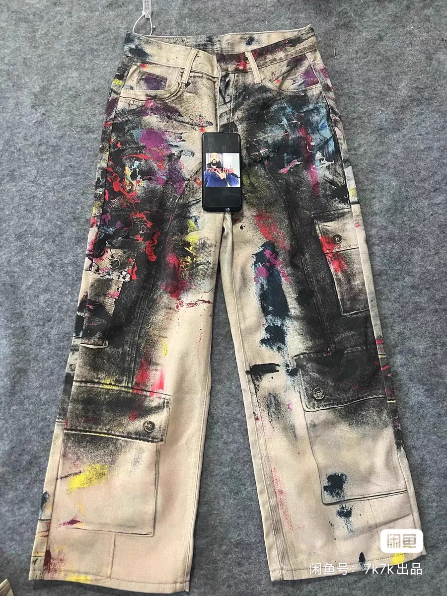 Real hand-painted denim pants with layered artwork