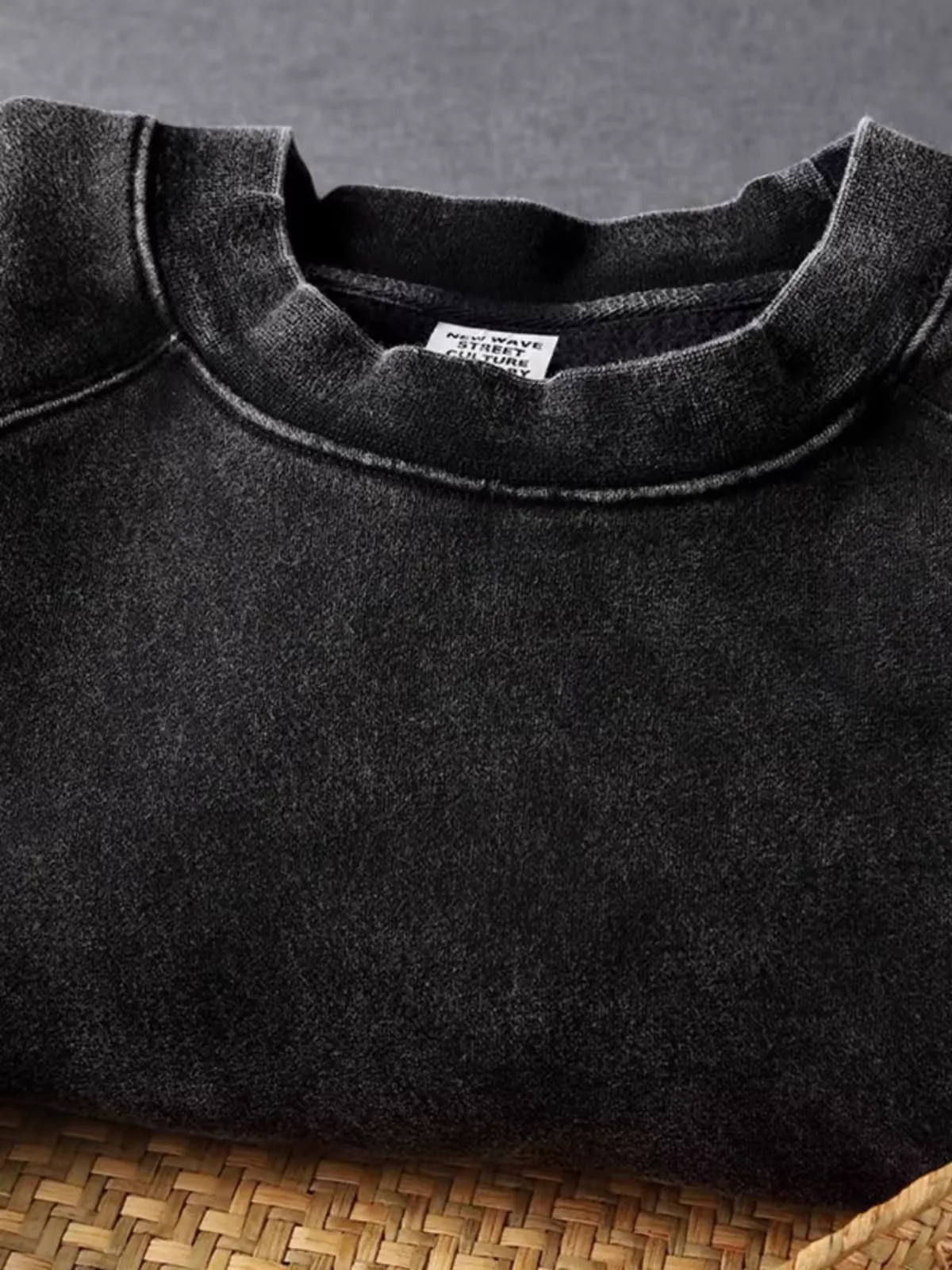 Real washed black garment finish at the neckline